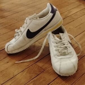 Nike White Sneakers with Black Swoosh and Purple Heel